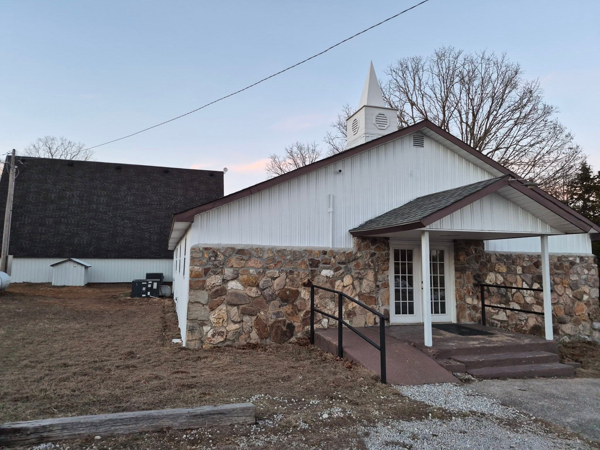 The stone entrance and steeple of Fundamental Bible Baptist Church